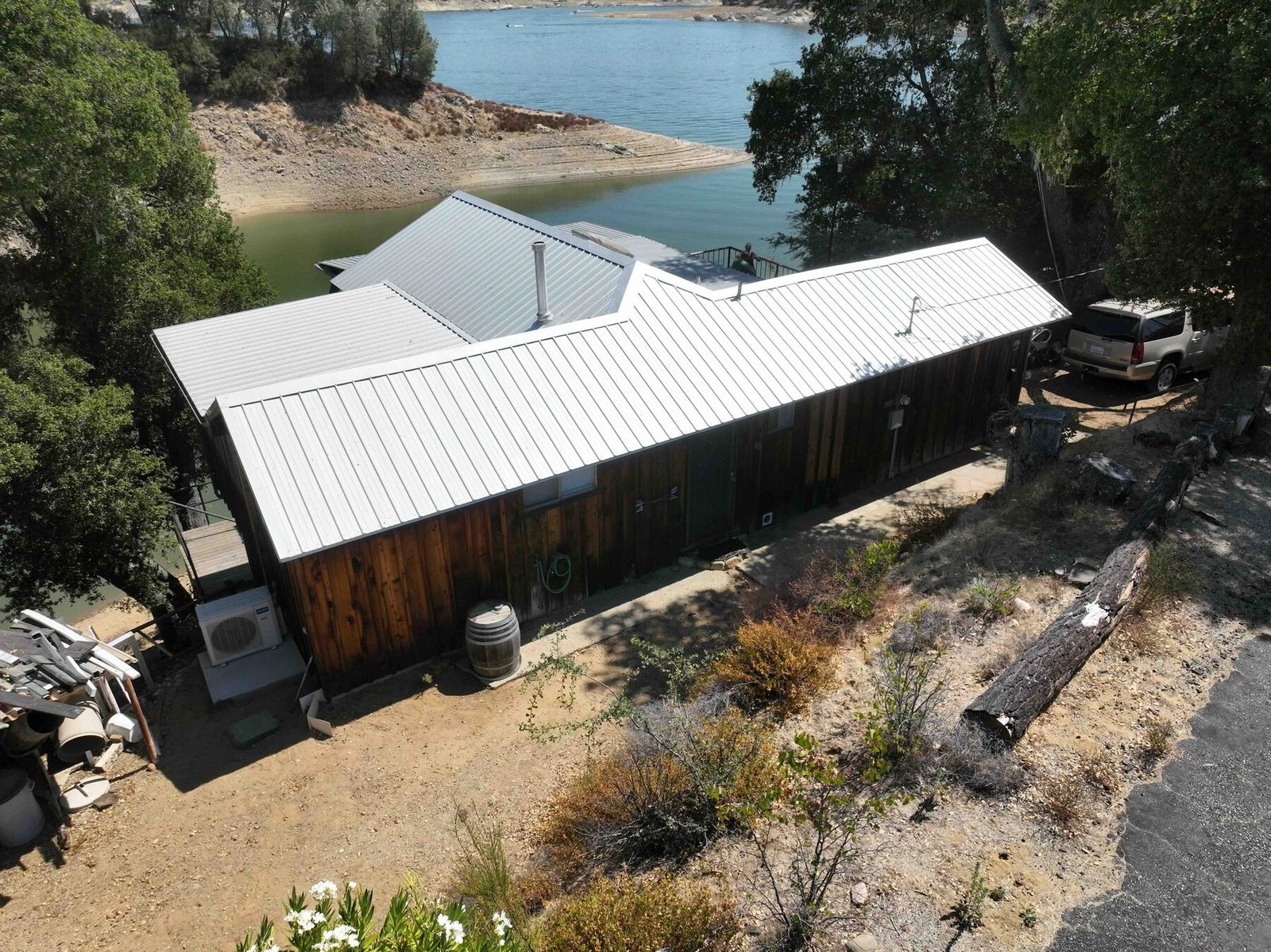 Aerial view of the house with lake in background