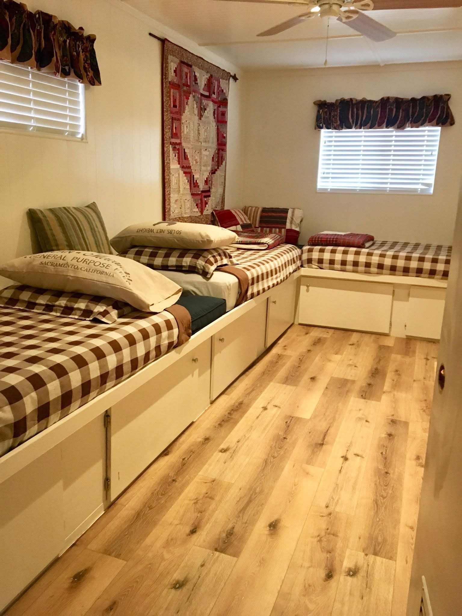 Bunk room with twin beds and quilt